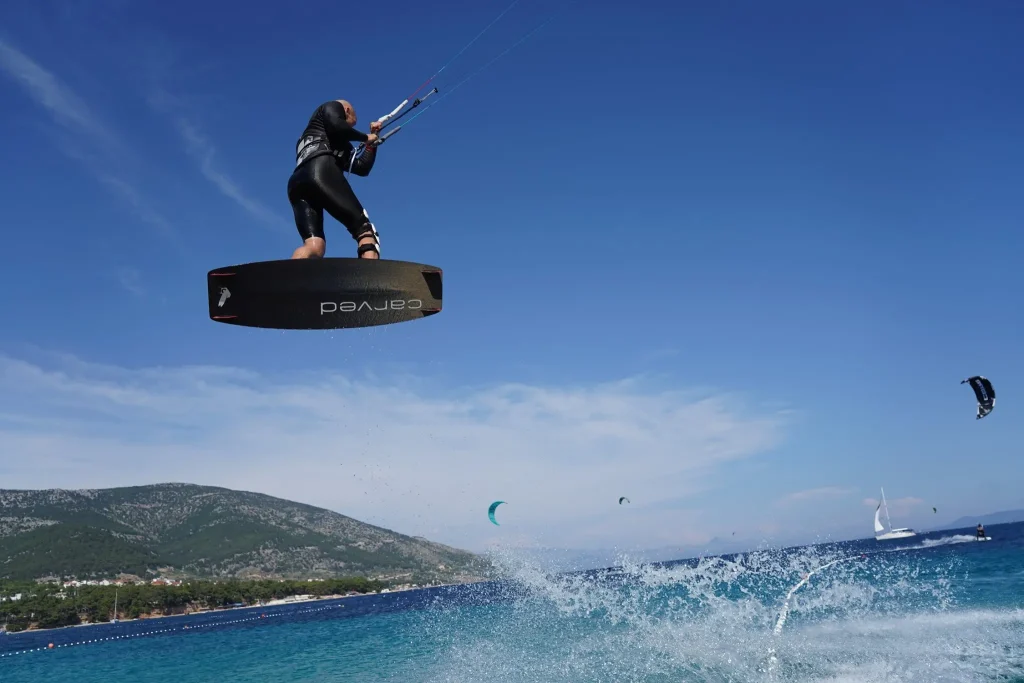 Kitesurfer jumping above the sea in Bol