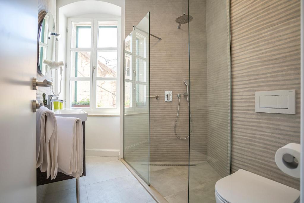 Bathroom with a glass shower at Piano Nobile Rooms in Split