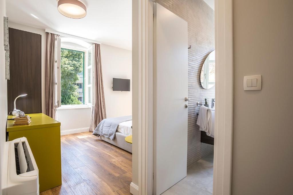Bedroom with a window at Piano Nobile Rooms in Split